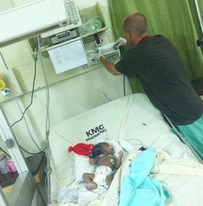 doctor treating small child in a hospital